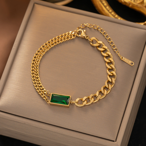 Gold bracelet with green emerald-style rectangular stone